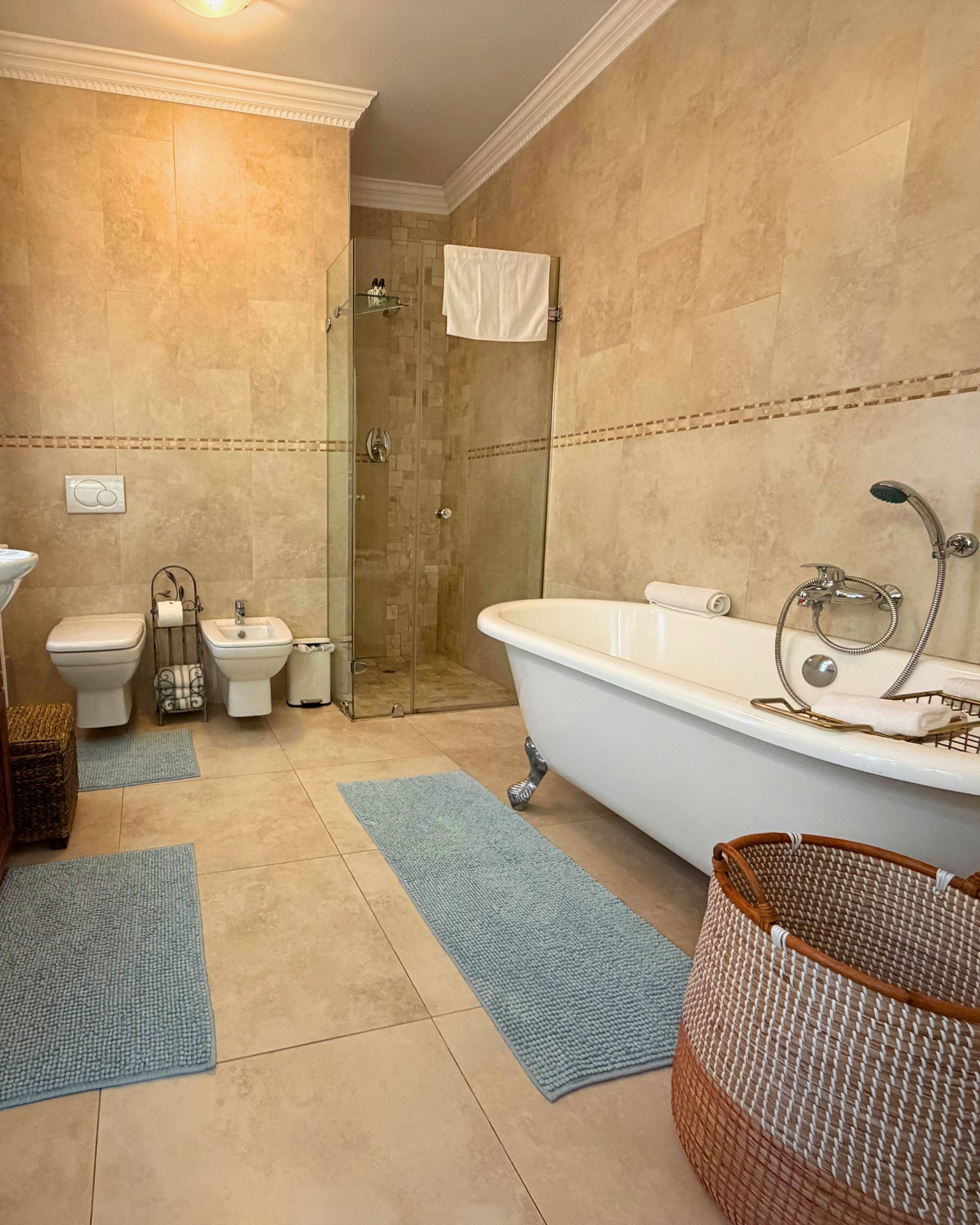 En-suite bathroom with clawfoot bath and shower