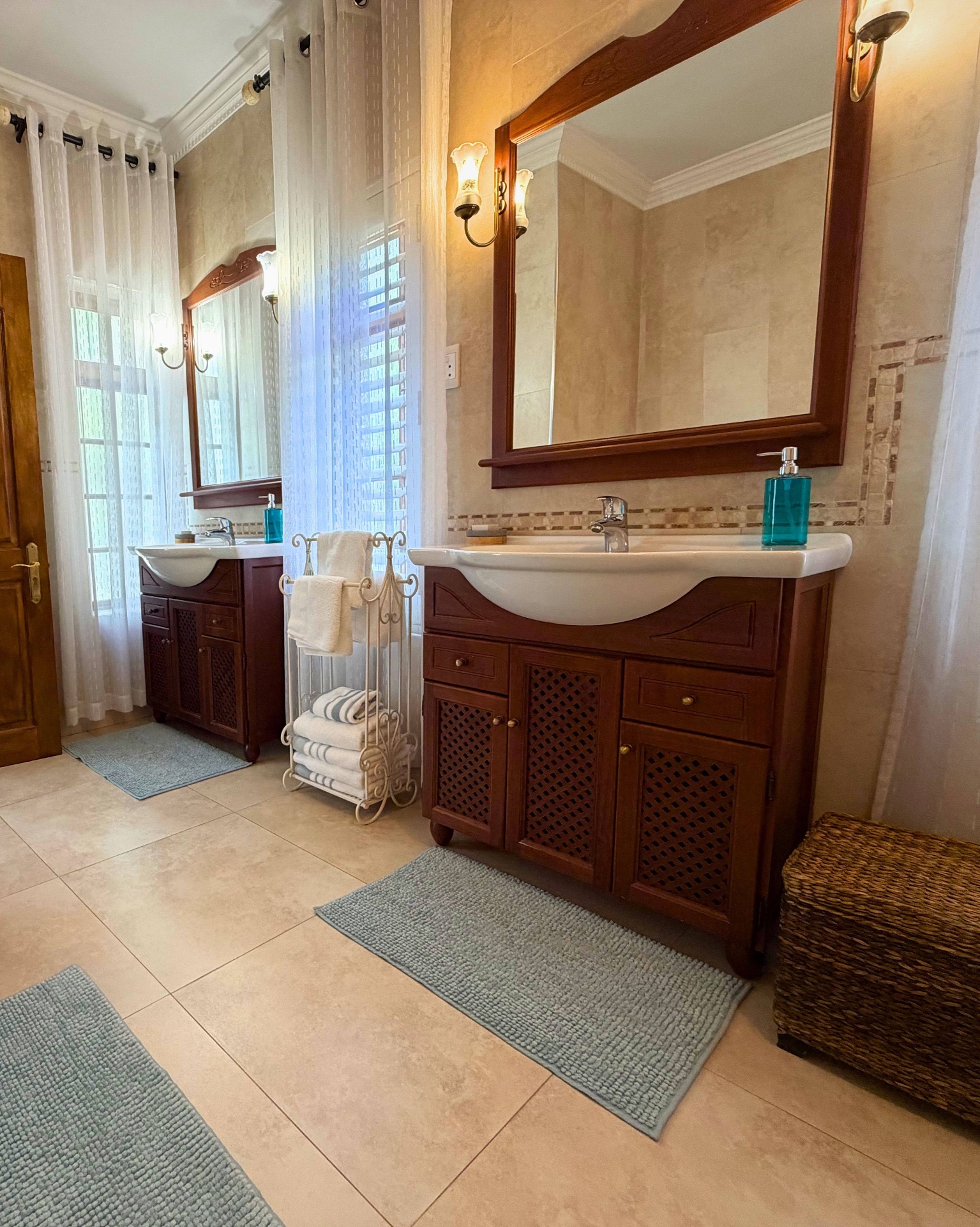 En-suite bathroom with twin vanities